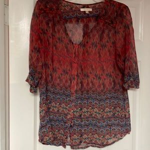 Long sheer top with accompanying navy tank top